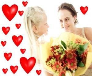Puzle Dívka s kyticí pro jeho matku a červené srdce