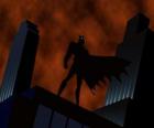 Batman pozoroval město ze střechy budovy v Gotham City