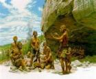 Skupina mužů neandrtálský pod ochranou rock přístřeší, osoby realizace různých činností: chartting kameny, další příprava lovu
