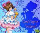 Sakura, karta únosce s jedním z jejích šatů vedle Kero