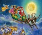 Santa Claus saně letí nad domy na Štědrý večer