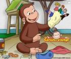 Opice zvědavý George dělá loutky